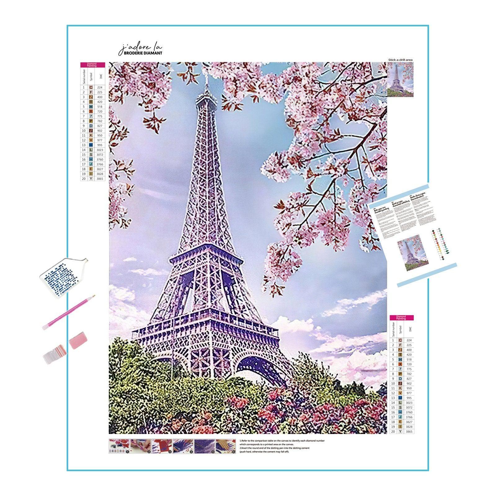 A breathtaking view of cherry blossoms with the Eiffel Tower in background.Cherry Tree Under Eiffel Tower - Diamondartlove